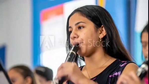 Teenage girl playing clarinet