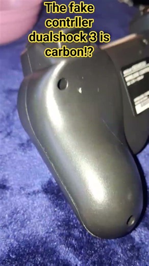 the dualshock 3 original is light and fake carbon
