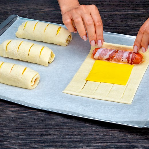 Forget all the recipes! This is the simplest and most delicious appetizer I've ever eaten! Ingredients: puff pastry: 600 g (21 oz) ketchup: 25 g (0.9 oz) mayonnaise: 25 g (0.9 oz) bacon: 150 g (5.3 oz) sausages: 400 g (14 oz) melted cheddar pressed cheese: 100 g (3.5 oz) eggs: 1 pc hot sauce: 25 g (0.9 oz) Sauce: mayonnaise: 25 g (0.9 oz) ketchup: 25 g (0.9 oz) chili sauce: 25 g (0.9 oz) mustard: 25 g (0.9 oz) black pepper: 10 g (0.4 oz) salt: 10 g (0.4 oz) sweet paprika: 10 g (0.4 oz) garlic po