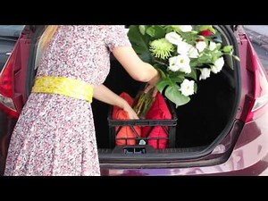 How to safely transport a flower arrangement in a car
