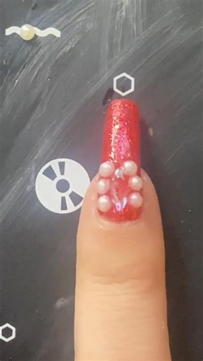 Gemming up my nail on top of sparkly red Holo Taco polish ￼