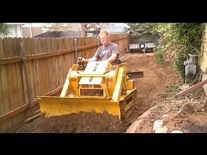Mini Bull Dozer Struck Magna Trac Junior moving dirt