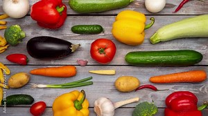 Fresh vegetables are fighting against fast food, fries. Healthy vs unhealthy food consept. Stop motion.