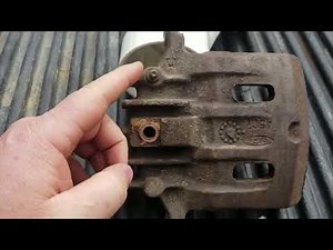 Soft spongy brakes after replacing a brake caliper? Is it upside down?