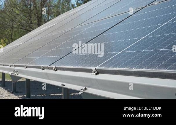 Solar panel mounting structure and support frame in outdoor field. Photovoltaic power station installation generates clean electricity for sustainable energy infrastructure development Stock Video Footage - Alamy