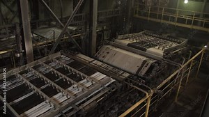 Sludge moves along the conveyor belt, thickening and dewatering. Wastes from process of cleaning coal from garbage rock