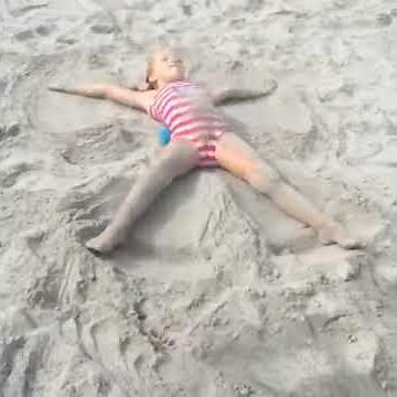 Making sand angels at the beach