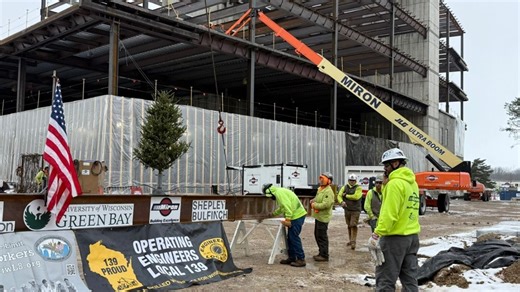UW-Green Bay's new library hits high point in construction with 'topping out' ceremony