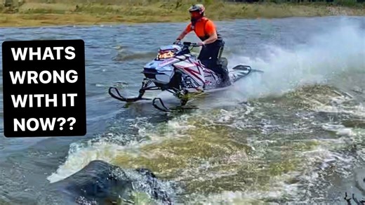 Racing Snowmobiles Through a Flooded River