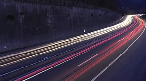clip-1027511006-timelapse-traffic-on-highway-creating-red-white
