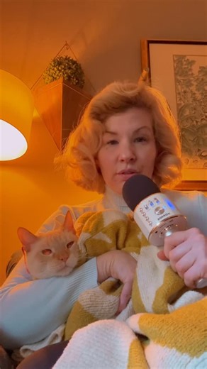 Found the Karaoke mic for daylight savings time support. 🐈🛋️🎤 | Emily West