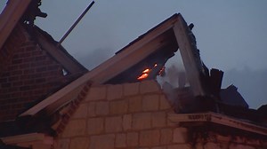 Firefighters battle house fire in Keller as storms roll through Wednesday morning