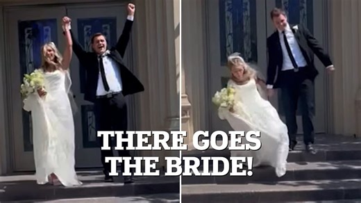 Bride takes an epic tumble down the stairs as she leaves wedding ceremony
