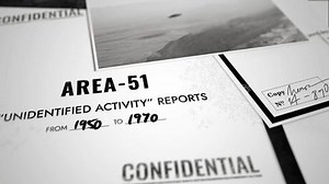 Various top secret and classified looking documents about UFO and alien activity. Camera moves slowly over files and papers with photographs and sensitive information about unidentified phenomenons
