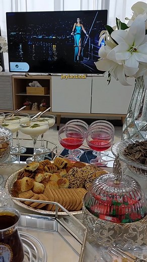 Elegant Tea Serving Ceremony with Snacks and Decor