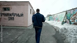 Lonely man running forward, back view. slow motion shot at 60fps