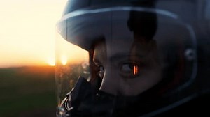 clip-3404888407-moto-woman-helmet-sunset-female-motorcyclist-close