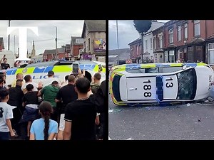 Leeds riot: moment crowd overturns police car