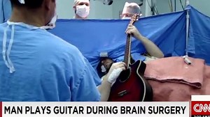 Man plays guitar during brain surgery