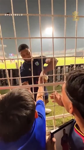 Royal Challengers Bengaluru on Instagram: "If you needed a reason to smile today, this is it. 🥹❤️ Romario Shepherd took time out at practice to meet a young RCB fan. Pure joy. ✨ 🎥: A lucky RCB fan 🥰 #PlayBold #ನಮ್ಮRCB"