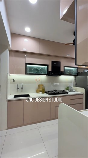 JNC DESIGN STUDIO on Instagram: "Sleek glass-acrylic kitchen with a 16 mm full-body tile countertop and bold black-profile shutters—modern style with lasting strength. @jncdesignstudio #ModernKitchen #GlassAcrylic #FullBodyTiles #BlackProfile #LuxuryInteriors #ContemporaryDesign #ModularKitchen #ElegantSpaces #KitchenGoals #InteriorInspiration"