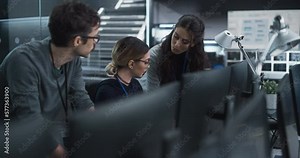 Group of Empowered Multicultural Specialists Working in a Research Center, Using Computer to Collaborate on Advanced Software, Develop Artificial Intelligence Interface and Cloud-Based Blockchain