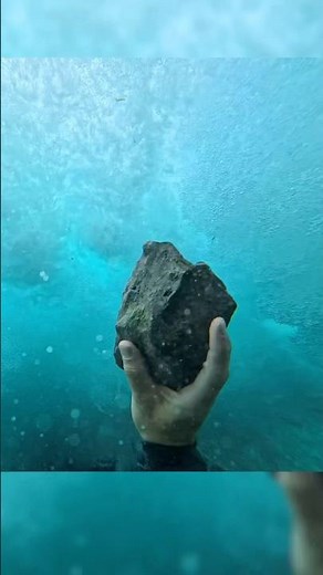 Throwing a rock into a waterfall