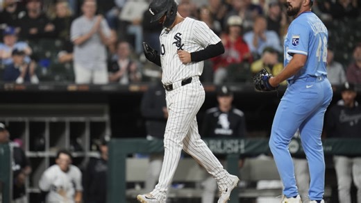 Miguel Vargas scores on a wild pitch