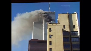 Rare video shows a woman named Edna Cintron waving from the hole created by Flight 11 crashing into the World Trade Center, shortly before the entire building collapsed. September 11, 2001