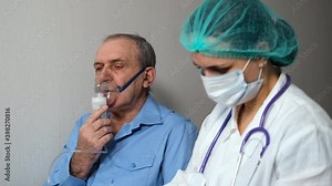 Old Man Does Inhalation Therapy with Nebulizer while Female Doctor Writes Notes. Medical Consultation at Home. COVID-19 Pandemic, Respiratory Problem, Allergy and Asthma Concept