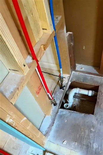 Looks like there's a water heater connection with some purple pipe stuff (maybe plumber's tape?) and a brass fitting.#fblifestyle | Plumbing Life