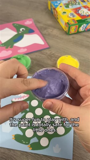 Learning through play with dinos! Make their first artwork with yellow, green and purple fingerpaint! #fingerpaint #kidsactivities #artforkids #creativekids #dino Did you use fingerpaint as a kid? | SES Creative