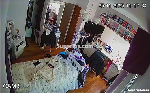 A chubby, red-haired cutie is walking around completely naked in her bedroom
