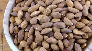 Almond kernel in a bowl. Background view from above. Healthy food