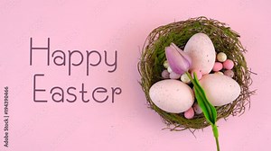 Happy Easter overhead with Easter eggs and decorations on a wood table background, with animated text.