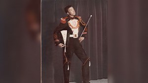 Officials unveil statue honoring first Black drum major at Muskegon Heights High School