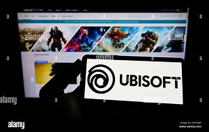 Person holding cellphone with logo of French video game company Ubisoft Entertainment SA on screen in front of web page. Focus on phone display Stock Photo - Alamy