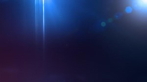 Download A blue light shines on a dark background for free