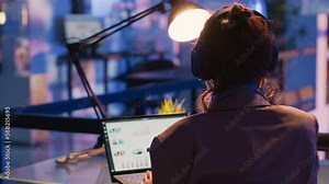 Executive manager looking at marketing statistics on pc, working after hours to create financial report for profit. Company employee planning business investment for corporate development.