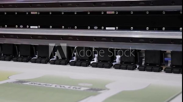 High resolution Industry printer. Industrial inkjet printer in operation. printing patterns on large sheet of fabric or paper. Automate printer for modern textile printing and digital print technology