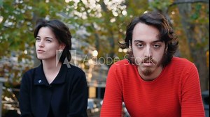 talkative woman - young man exhausted by his friend's speech