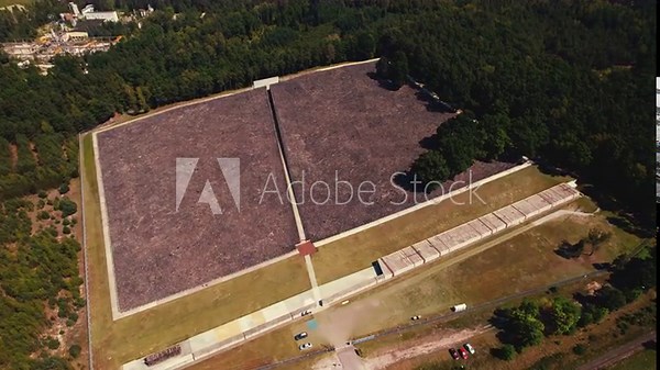 Belzec Death Camp. Former nazi death camp ruins in the middle of green forest. Birdseye view of holocaust memorial museum grounds. Horizontal shot. High quality 4k footage