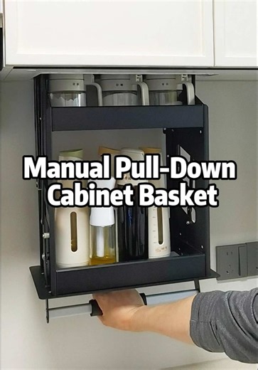 Installing a manual pull-down basket inside an upper cabinet. The hardware is mounted directly to the cabinet sides, then adjusted so the basket moves smoothly up and down. A practical upgrade for making high cabinet storage easier to reach.