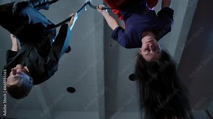 Video of couple hanging upside down on ring