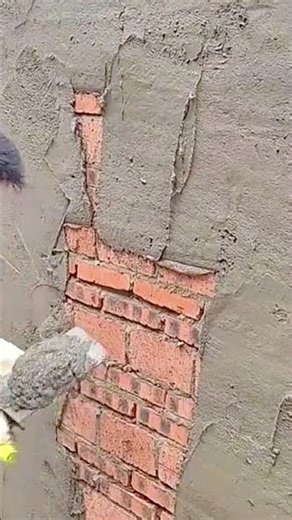 Applying Cement Plaster to Smooth and Repair a Brick Wall