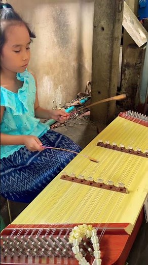 Talented girl plays Hammered Dulcimer Traditional Thai Music instrument at Koh Kret Thailand