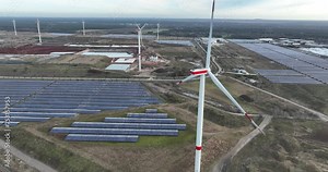 Solar panel park on an industrial site, called Kristal Solar Park. Sustainable energy production by using the natural light of the sun. Avoids CO2 emissions, green energy. Aerial drone view.