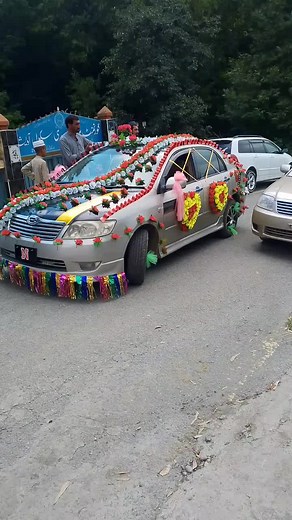 Decorated Car Procession with Floral Arrangements
