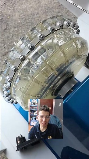 How does a torque converter in an automatic transmission work?