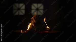 Sacred Eternal Flame in Zoroastrian Fire Temple. Atash Behram at the Fire Temple of Yazd in Iran, Established 1934. Dance of fire symbolizes sacred traditions, and struggle between light and darkness.